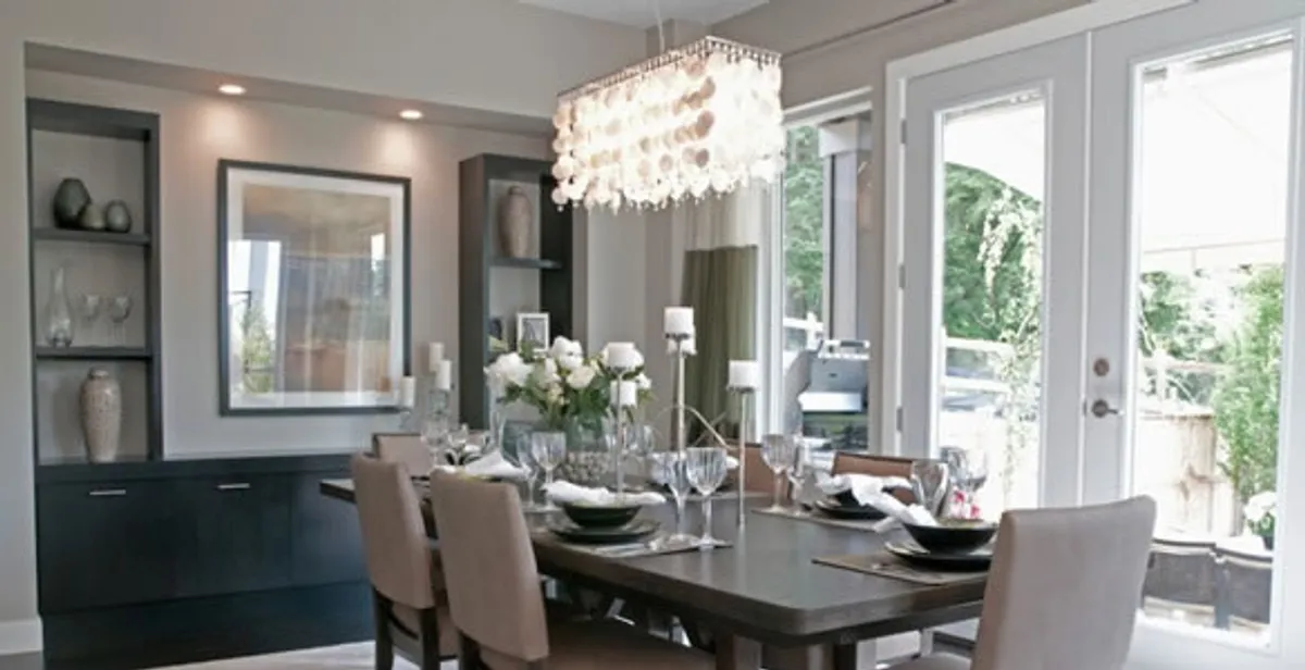 Elegant dining room chandelier installation above table in Chandler, AZ