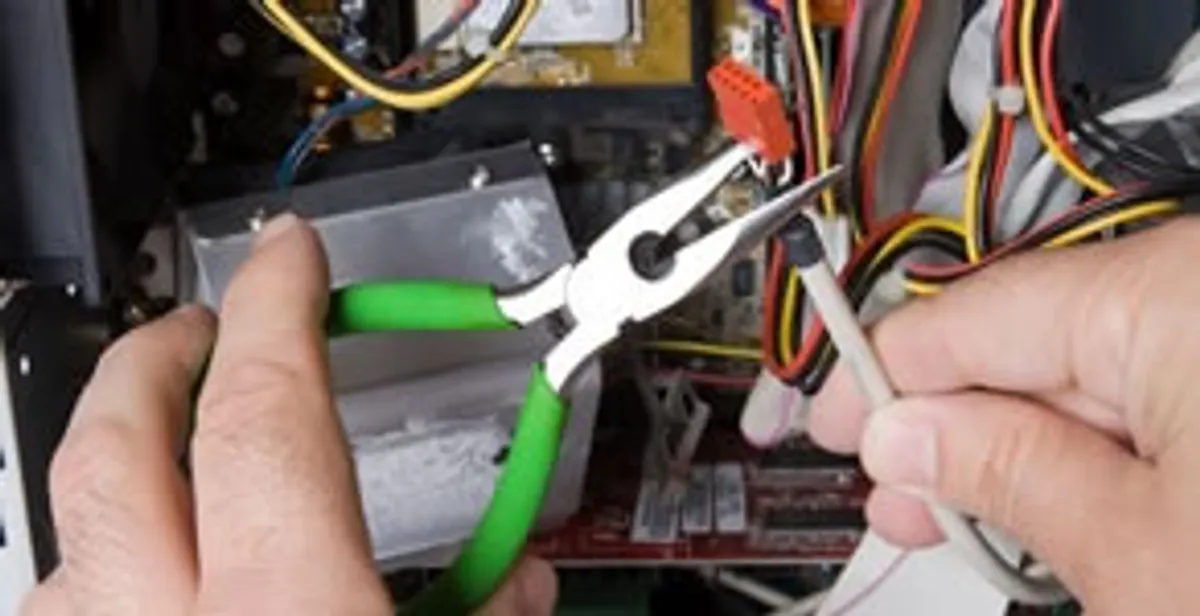 Licensed electrical contractor performing electrical repair with tools in Chandler Heights, AZ